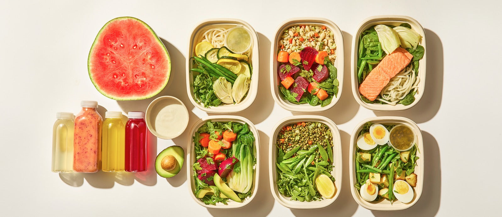 A week of prepared Gut Reset meals, juices, and produce