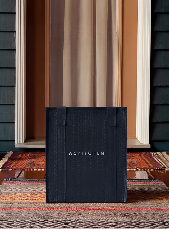 ACKITCHEN insulated tote bag delivered to a doorstep